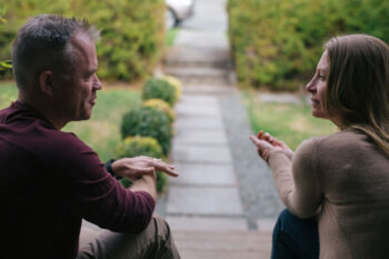 A couple has a serious conversation. Learn more about vaping and tobacco use in Colorado.